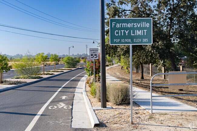 Travelers and visitors are greeted by the Farmersville City Limit sign.