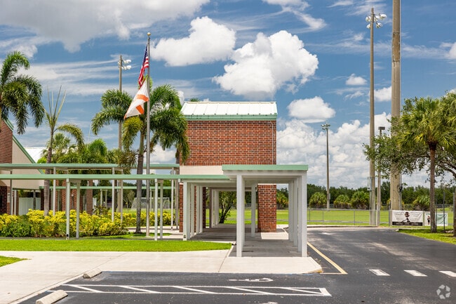 Corkscrew Middle School in Naples features a covered pick-up and drop off area at the entrance.
