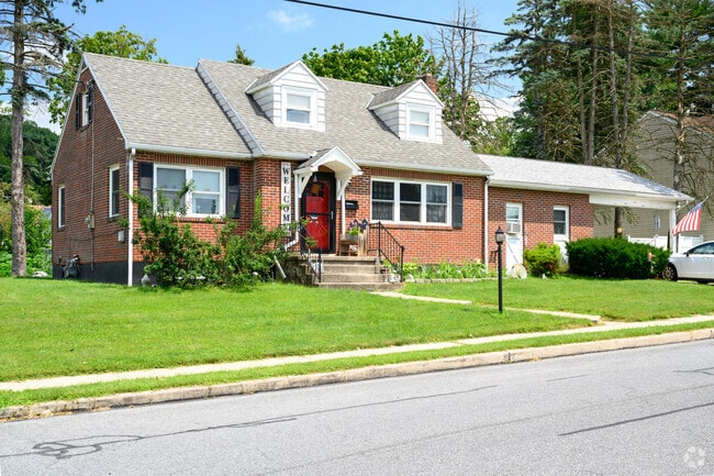 Historic homes with brick accents and manicured lawns are typical in Laureldale.
