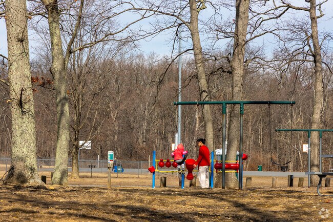 Woodlot Park has multiple playgrounds for local families to enjoy.