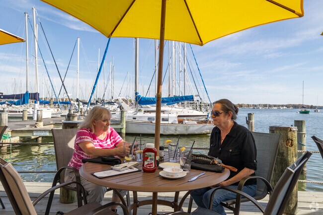 Good friends enjoy a meal on the waterfront at Pirates Cove.