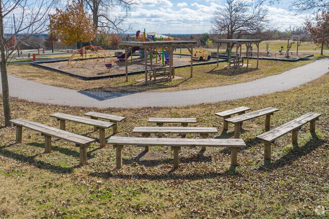 Woody Wilson Park has amphitheater-style benches overlooking the playground.