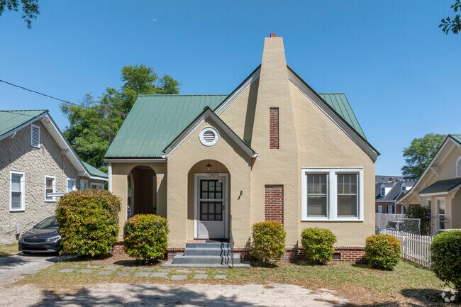 The distinct chimney feature on this  Tudor Cottage in Highland Park has tremendous curb appeal.