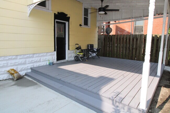 Private covered patio leads to ground level patio.