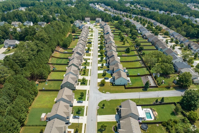 Houses in Cedarcrest sit on lots with fended-in backyards.