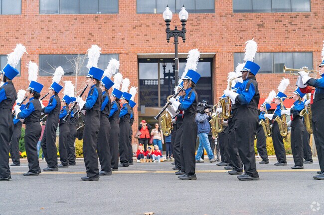 The Quincy High School Band closes the parade with their in line formation performance.