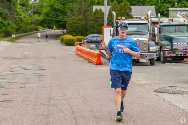 A runner of the BHZ Run Club finishes their route at Barrel House Z in East Weymouth.