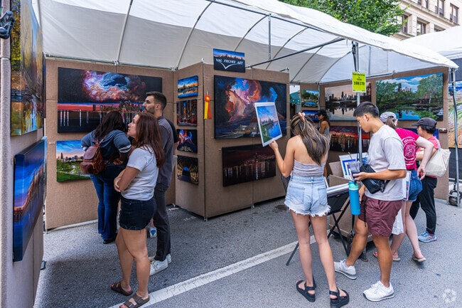 Visitors look for a new piece at the Printer's Row Art Fest.