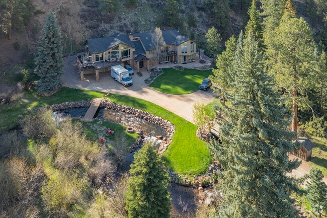 Just outside Denver, Upper Bear Creek offers a peaceful escape into Colorado’s lush mountain wilderness. Creekside homes nestled among towering pines define rural mountain living with unrivaled serenity and natural beauty all around.