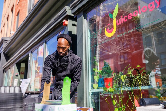 Chef Larry Ross of Vegan Juiceology in Downtown Baltimore crafts the plant-based O.G Burger.