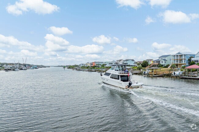 The calm waters around Holden Beach are ideal for kayaking and paddleboarding, providing opportunities to observe local wildlife and enjoy scenic views.