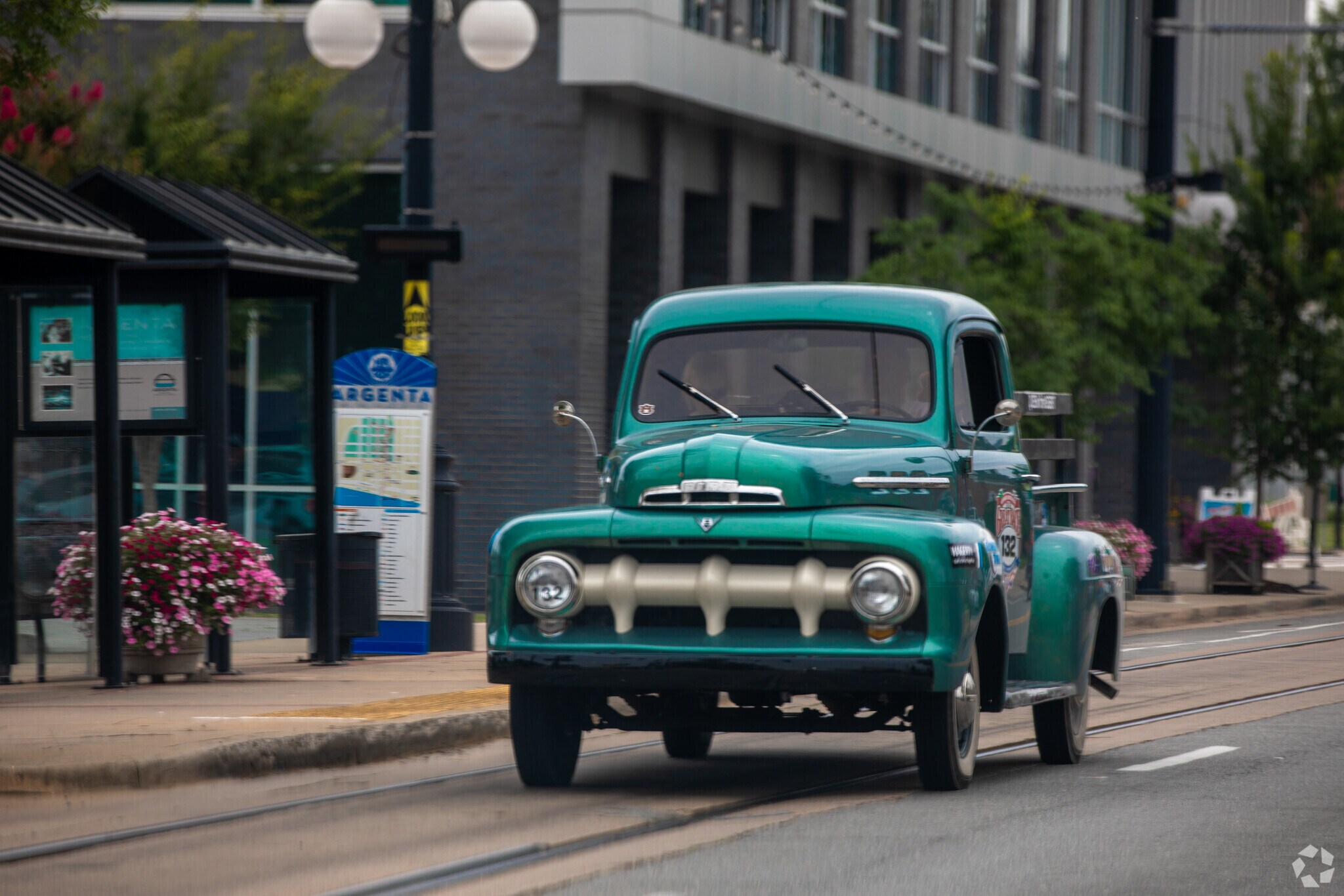 An old truck drives down Main Street near North Argenta.