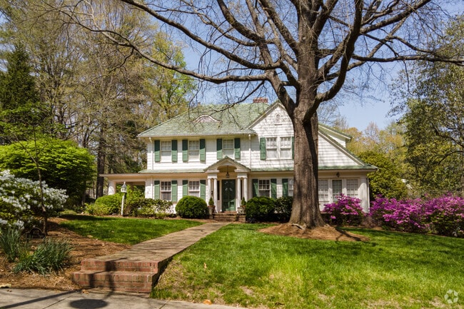 Shingle-style homes in Greater High Point blend natural textures with lush landscaping.