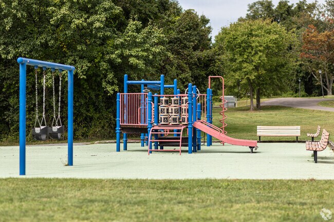 Local kids can burn off energy at the playground, surrounded by a peaceful atmosphere.