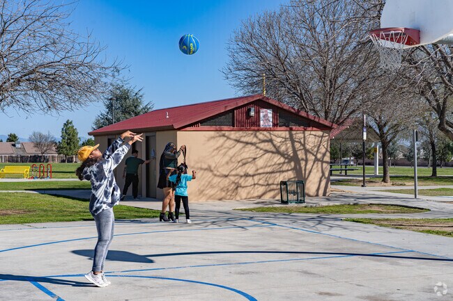 A young North Country Meadows resident practices her free throw at the nearby basketball court.