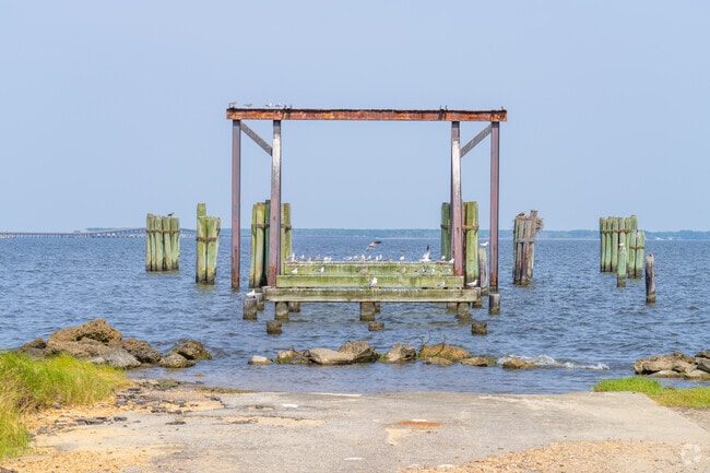 The remnants of an old ferry dock sit on the coast of Manns Harbor.