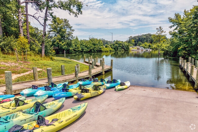 Colorful kayaks await paddlers at the Lake Smith boat ramp in Bayside.