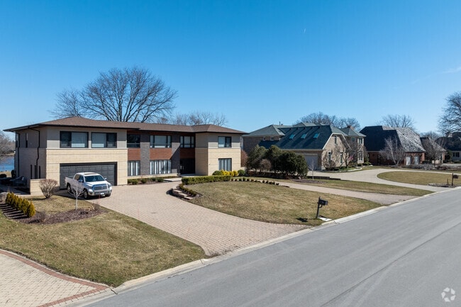 Brook Forest homes sit on big lots with tidy landscaping.