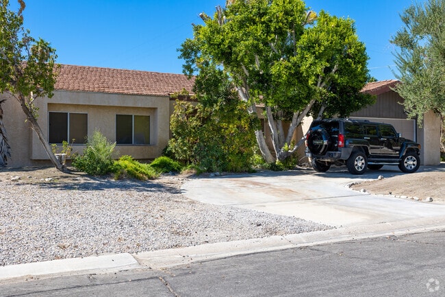 Your dream retreat awaits in the serene landscapes of Racquet Club South real estate.