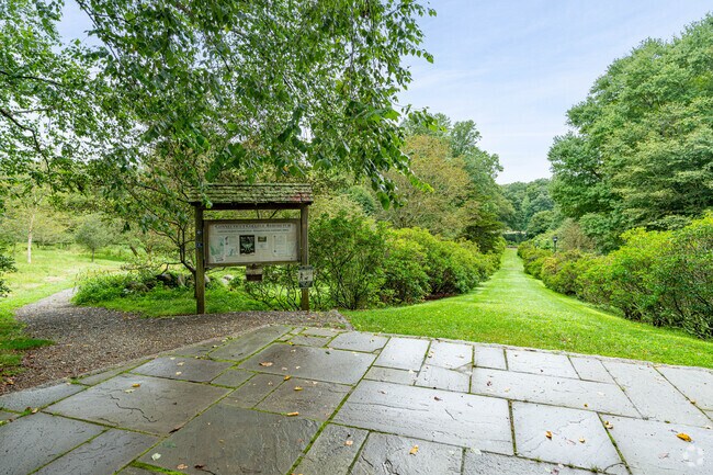 Residents enjoy the plush lawns at the Connecticut College Arboretum in Northwest New London.