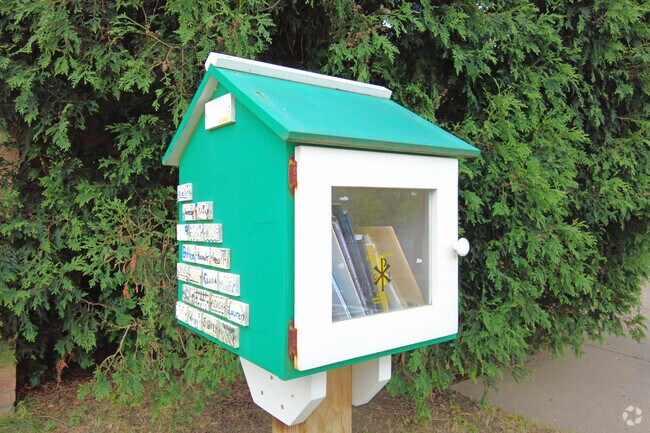 A free little library stands outside of Good Shepherd School for students to use.