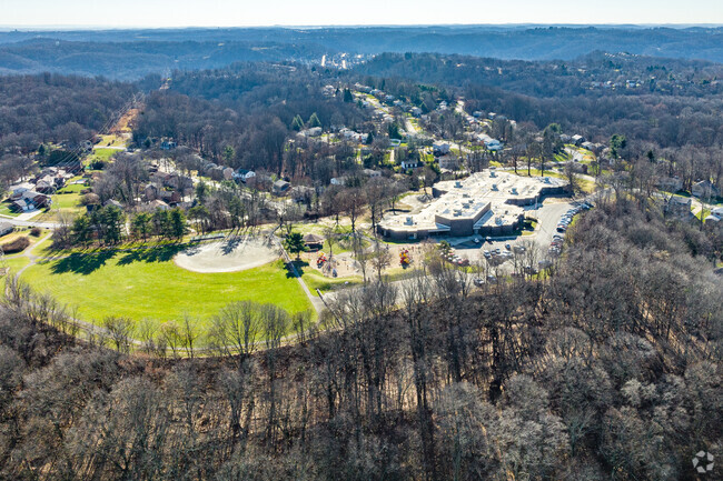 The Ramsey Elementary School campus is surrounded by large mature trees.