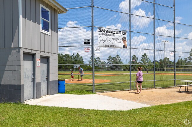 Families spend quality time together playing T-Ball at Viking Park near Semmes.
