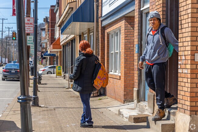 The sidewalks in the business district of Pitcairn are usually active.