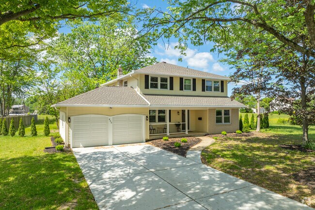 Greentree new traditional homes sit on tree lined streets shading properties.