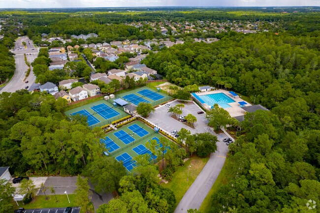Homes line the outskirts of the tennis/swimming club.