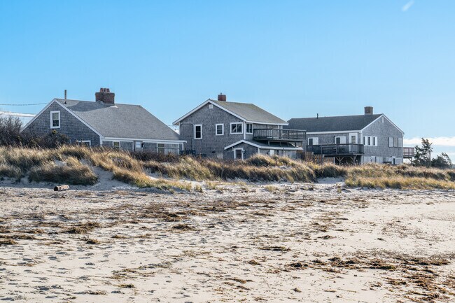 Beachside homes in Orleans draw homebuyers with stunning views and proximity to sandy shores.