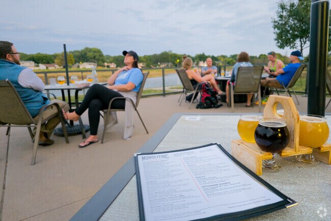 Monolithic Brewing near Candlewood offers a patio overlooking the neighborhood lake.