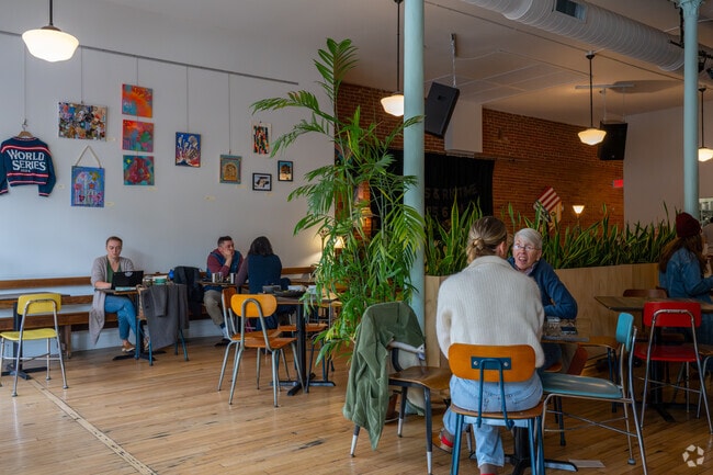 Locals from Springbrook-Clayton Johnson enjoy craft beer at The Root Note while live bands play sets.