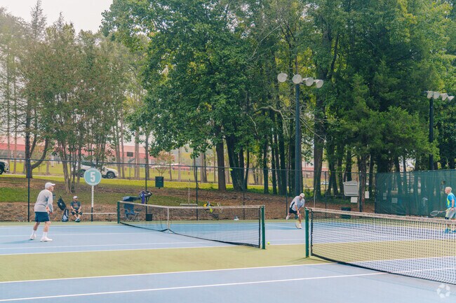 Locals of the are get together with friends to play a couple rounds of tennis in Longwood Park.