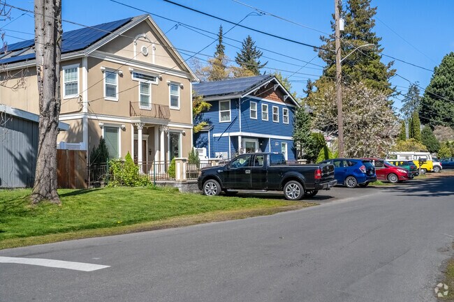 A row of colorful homes on a sunny spring day in Bitter Lake neighborhood.