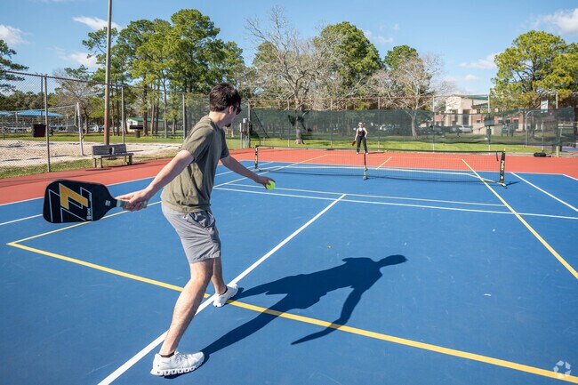 Residents enjoy playing pickleball at one of Friendswood's many courts.