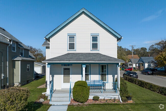 Sit on your front porch and enjoy the cool breeze in Northeast Joliet.