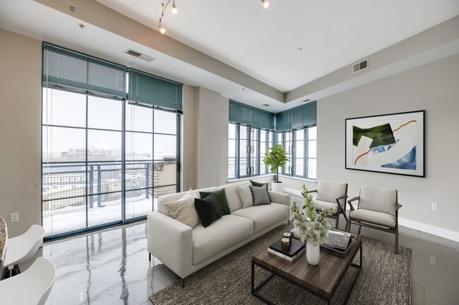 Living room with 10-foot ceilings with city views