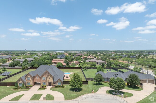 Airport Loop 322 neighborhood features elegant homes with pools and spacious private yards.