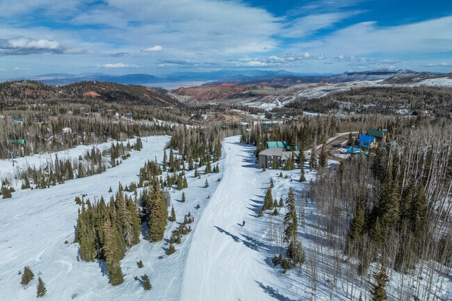 Cedar City's location allows for hiking trails through red rock and ski slopes down snow-covered mountains.
