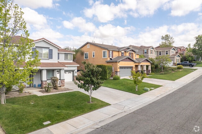 In Orangecrest, a row of spacious two-story new traditional homes lines a street.