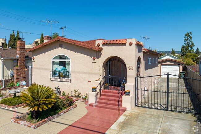 Spanish bungalow-style homes often feature red-tile roofs and arched doorways.