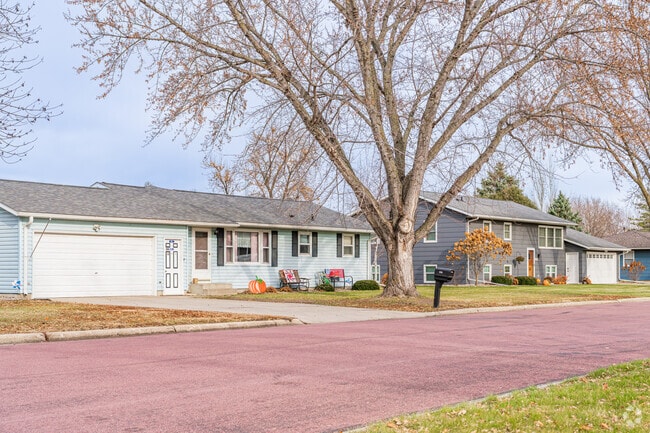 Colonial revival and ranch homes add classic charm to Redwood Falls’ shaded residential streets.