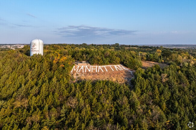 The Bluemont Scenic Overlook includes Manhattan lettering carved into the tree shrouded hill.