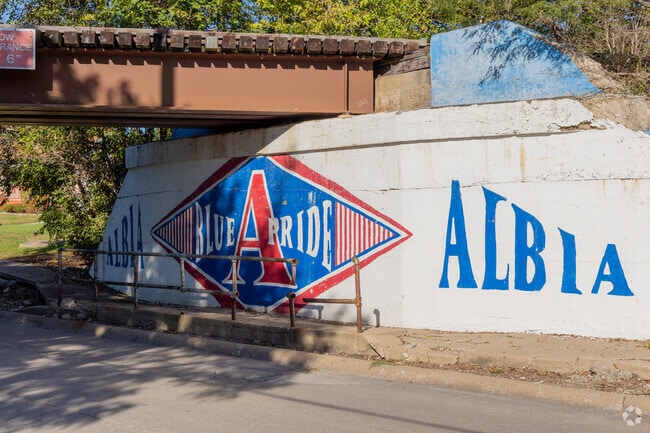 An Albia Pride mural adds color near the historic square.