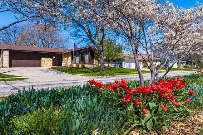 Part of Milwaukee's Garden District, Clayton Crest flourishes with front-yard flora.
