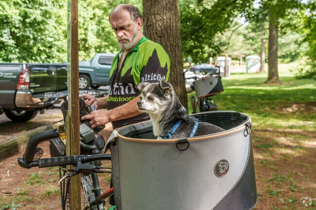 Four-legged friends are always allowed to hitch a ride along the Towpath Park path.