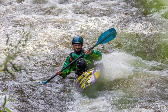 A whitewater kayaker enjoys his afternoon down Boulder Creek in West Pearl.