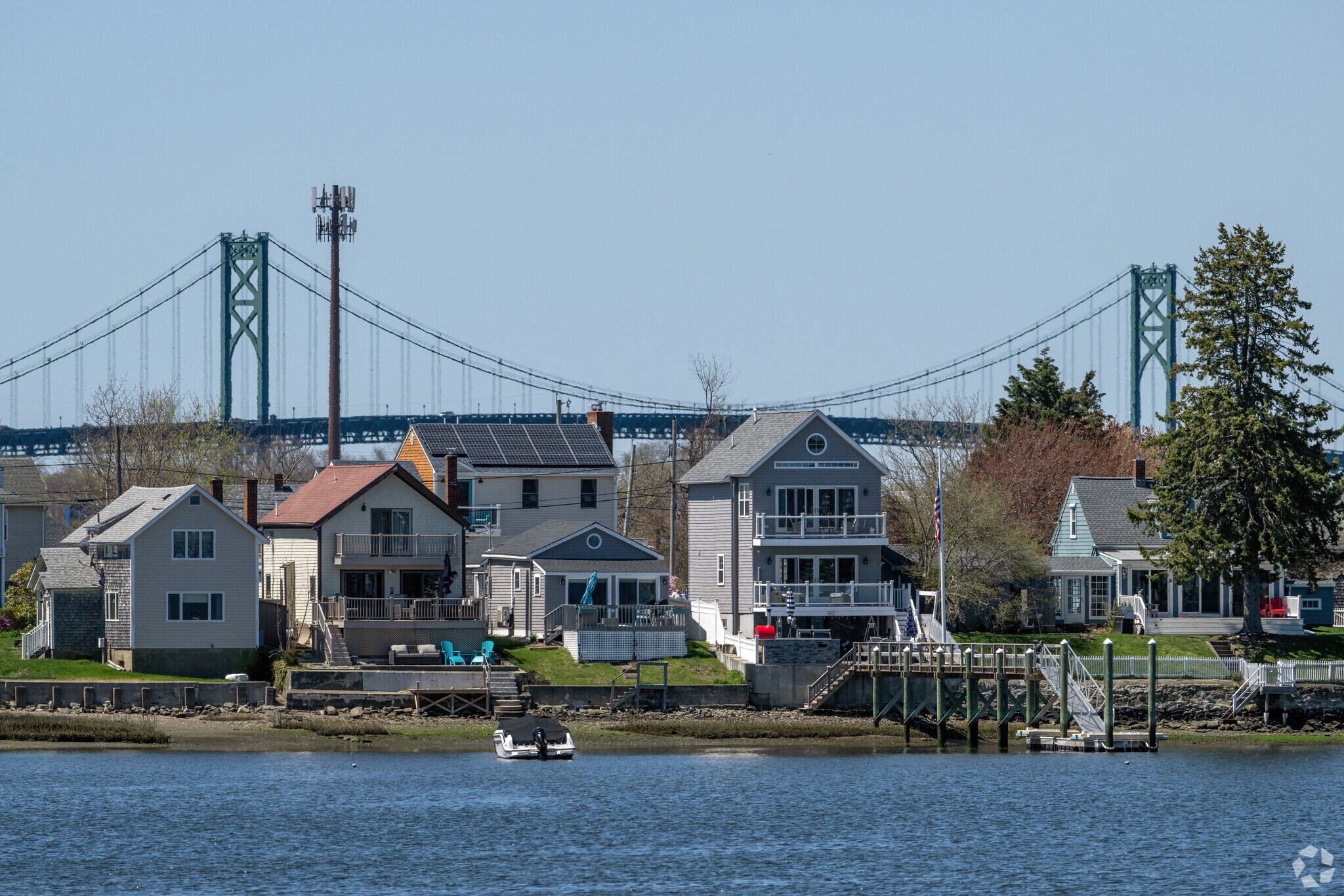 The historic Mount Hope Bridge connects Island Park to the mainland as an omnipresent symbol.