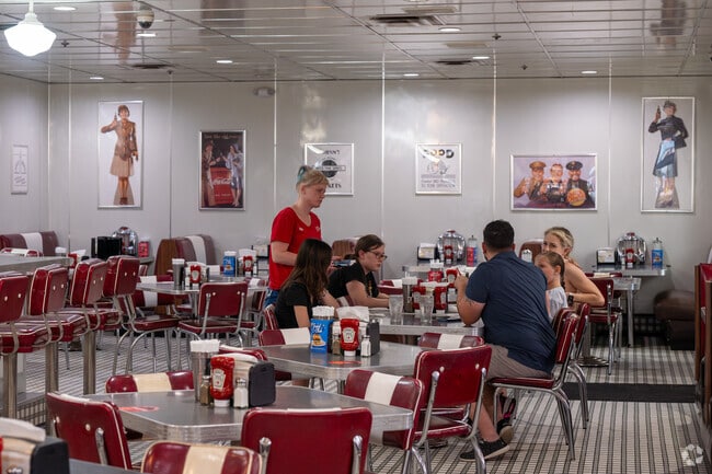 Village of Tall Trees families grab a burger & fries at Johnny Rocket's in Lake Sumter Landing.